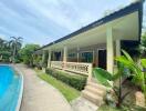 Exterior view of a house with a swimming pool