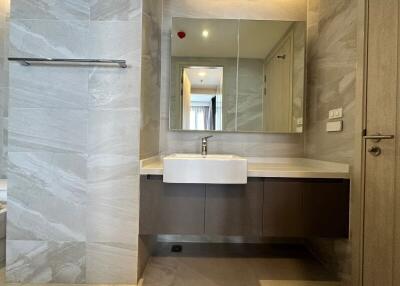 Modern bathroom with marble tile finish