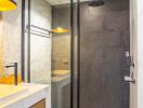 Modern bathroom interior with glass shower cabin and marble accents