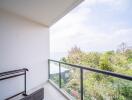 Spacious balcony with a scenic view and glass barrier
