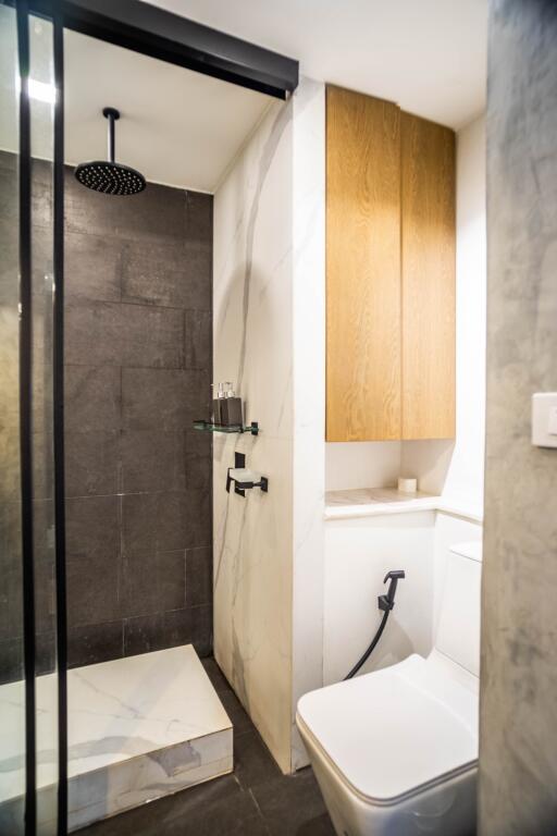 Modern bathroom with glass shower and stylish fixtures