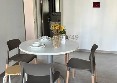 Modern dining area with a round table and chairs