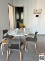 Modern dining area with a round table and chairs