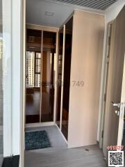 Entryway with open wardrobe and a view into the apartment