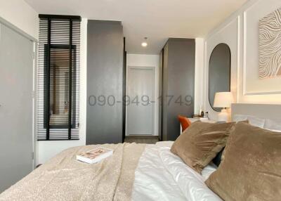 Cozy and modernly furnished bedroom with natural light