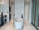 Modern bathroom with freestanding tub and glass shower
