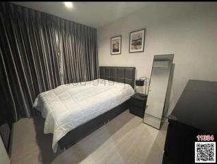 Modern bedroom with a large bed and contemporary furnishings