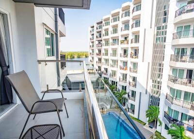 Modern apartment balcony with pool view