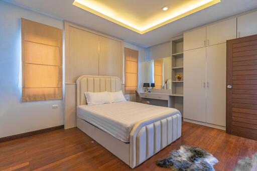 Modern bedroom with en-suite bathroom and ample lighting