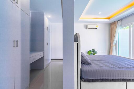 Modern bedroom with a comfortable bed and built-in wardrobes