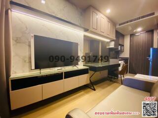 Modern living room with mounted TV and comfortable seating