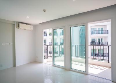 Spacious and well-lit living room with large windows