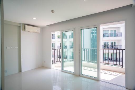 Spacious and well-lit living room with large windows