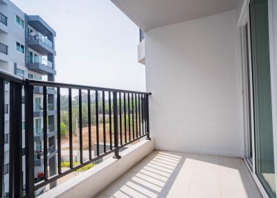 Spacious balcony with a view, featuring modern railings and ample natural light