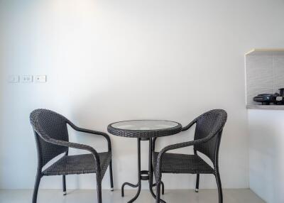 Minimalist dining area with table and chairs