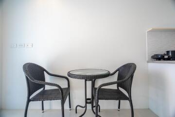 Minimalist dining area with table and chairs