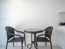 Minimalist dining area with table and chairs