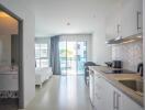 Spacious studio apartment with modern kitchen and elegant sleeping area