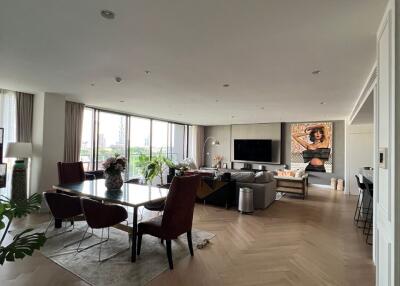 Spacious modern living room with dining area and large windows