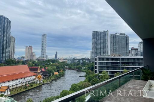 City view from the balcony of an apartment with river and skyline