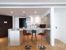 Modern kitchen with bar seating and wood flooring