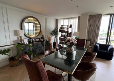 Elegant living room with dining area and panoramic windows