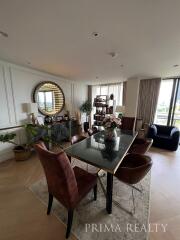 Elegant living room with dining area and panoramic windows