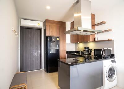 Modern apartment kitchen with stainless steel appliances