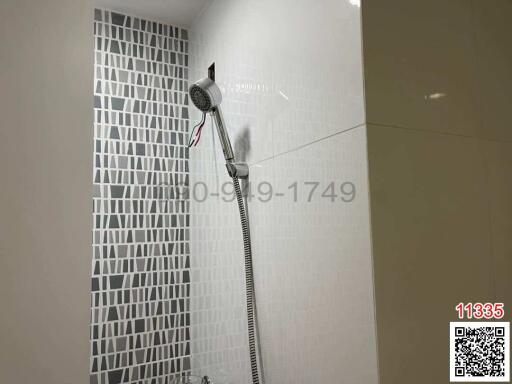Modern bathroom with tiled walls and shower
