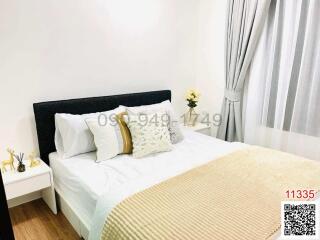 Cozy bedroom with a comfortable double bed, clean bedding, and a modern aesthetic