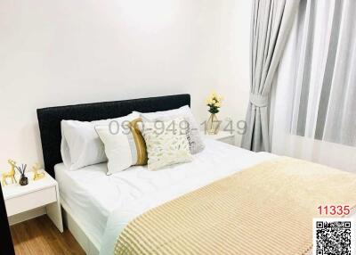 Cozy bedroom with a comfortable double bed, clean bedding, and a modern aesthetic