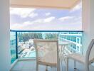 Bright and airy balcony with a view of the ocean and pool area