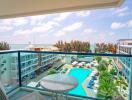 Balcony view overlooking a pool and the ocean