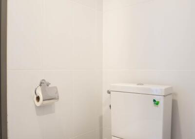 Modern white bathroom interior with a toilet