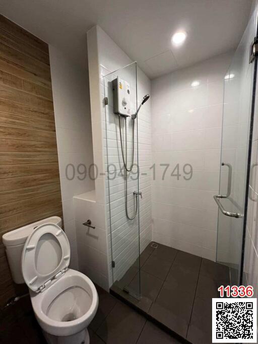 Modern bathroom with a walk-in shower and white ceramic toilet