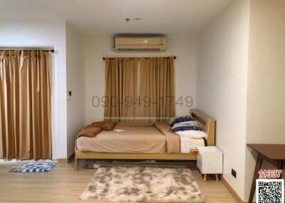 Cozy bedroom with modern furnishings and air conditioning