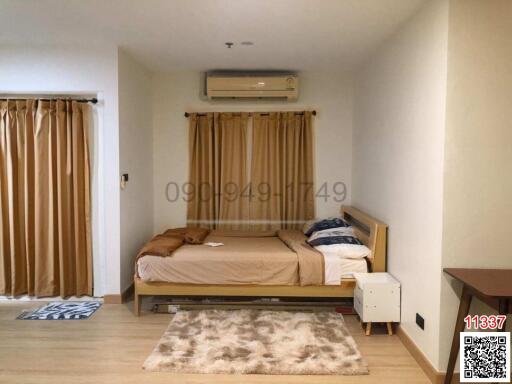 Cozy bedroom with modern furnishings and air conditioning