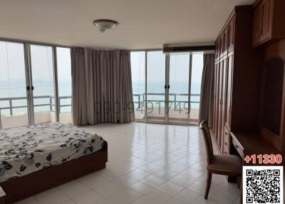 Oceanfront bedroom with large windows and ample natural light