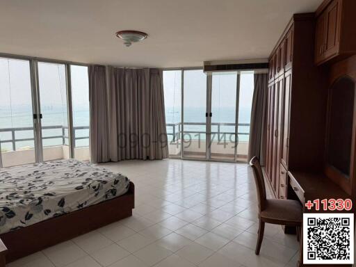 Oceanfront bedroom with large windows and ample natural light