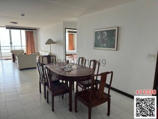 Spacious living room with dining area and ample natural light