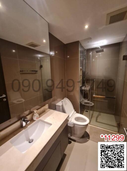 Modern bathroom interior with neatly tiled walls and floor