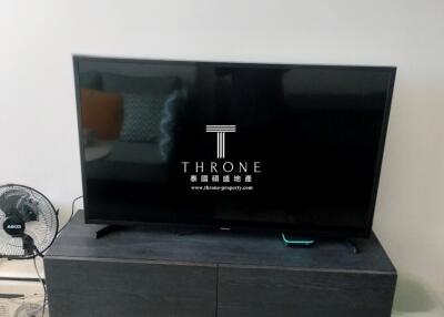 A television set on a TV stand in a modern living room