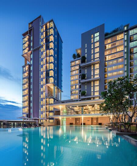 Modern High-rise Residential Building with Pool at Dusk