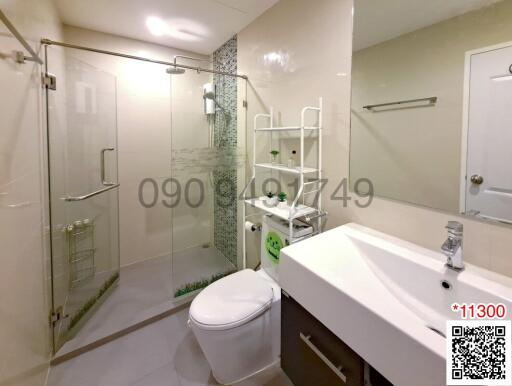 Modern bathroom with walk-in shower and white fixtures