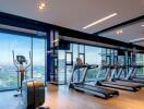 Modern gym with treadmills overlooking the city