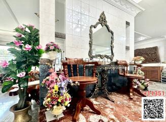 Elegant dining room with marble flooring and ornate mirror