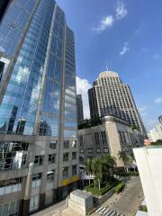 Modern skyscrapers with reflective glass facades under a clear blue sky