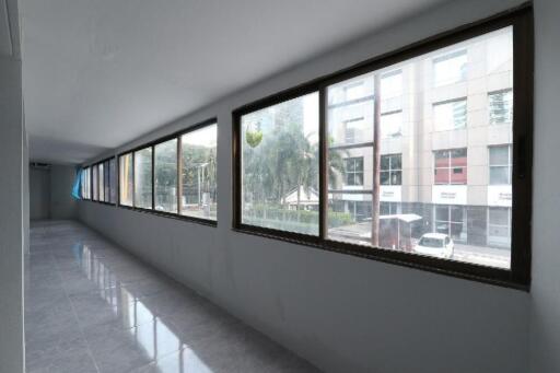 Spacious corridor with large windows overlooking the street