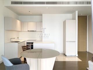 Modern kitchen with white cabinets and built-in appliances