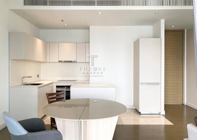 Modern kitchen with white cabinets and built-in appliances